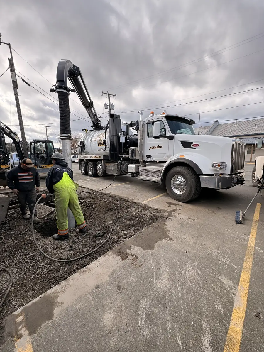 Hydro-excavating to expose a utility pole base