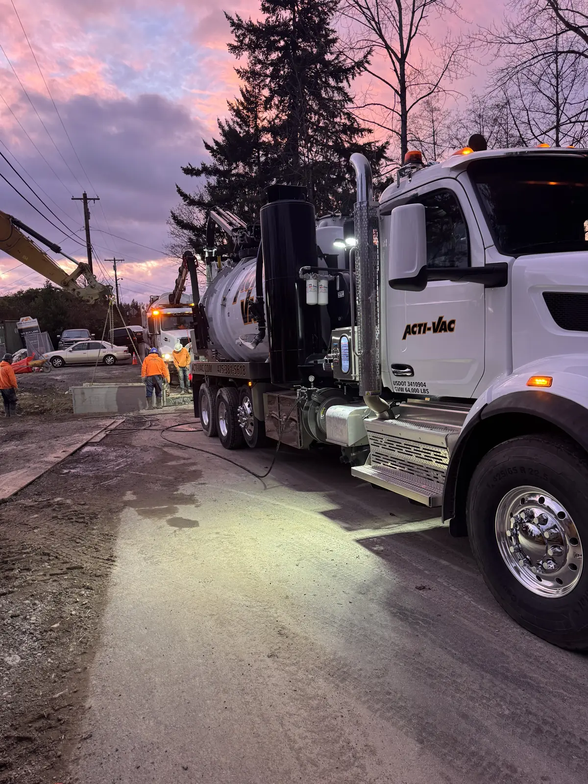 Acti-Vac hydro-excavation truck working at first light on a Puget Sound job site