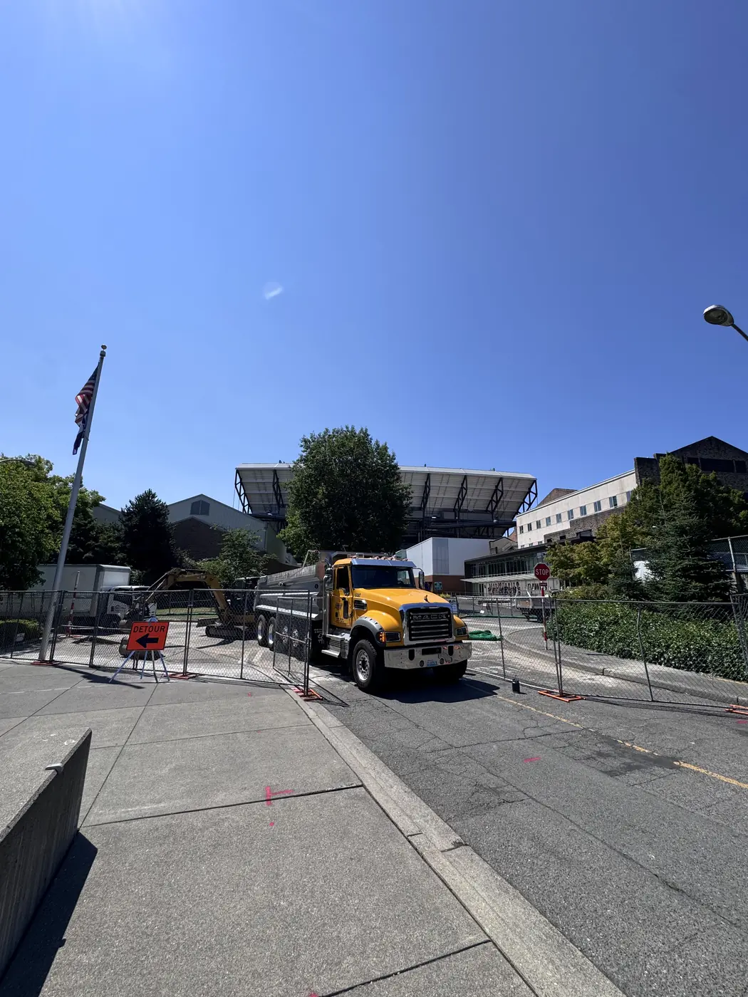 Always Active dump truck on site at the University of Washington, Husky Stadium behind